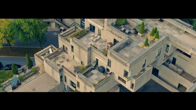 Video Reference: residential area, urban area, suburb, architecture, aerial photography, bird's eye view, neighbourhood, roof, city, home, Person