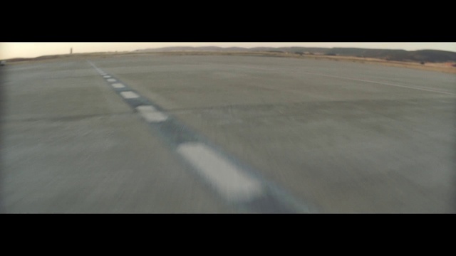 Video Reference: Asphalt, Runway, Road surface, Line, Race track, Air travel, Atmosphere, Horizon, Photography, Road
