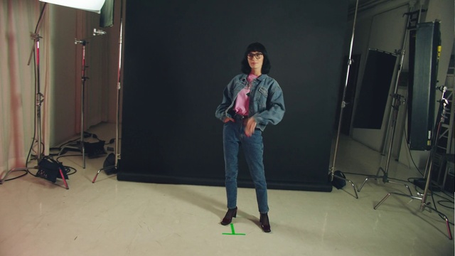 Video Reference: Green, Fashion, Jeans, Denim, Footwear, Shoulder, Photography, Talent show, Outerwear, Room