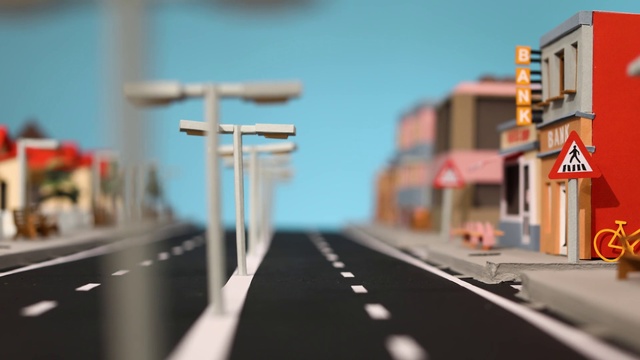 Video Reference: Road, Scale model, Lane, Transport, Sky, Infrastructure, Mode of transport, Highway, Street, Urban area