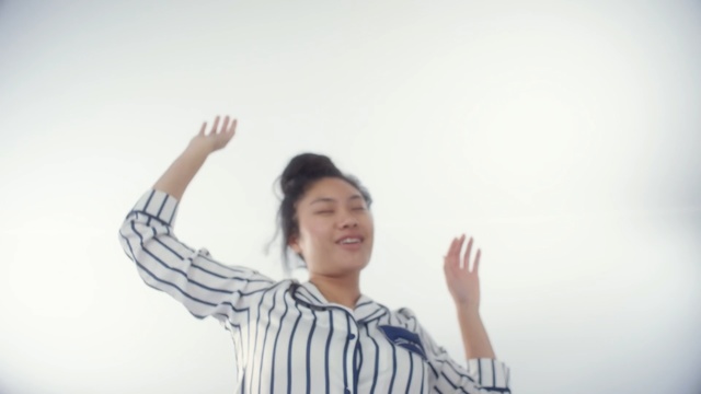 Video Reference: Gesture, Standing, Shoulder, Arm, Finger, Joint, Happy, Cheering, Fun, Sign language, Person