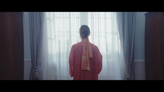 Video Reference: Photograph, Standing, Light, Snapshot, Fun, Textile, Adaptation, Sitting, Room, Screenshot, Person, Indoor, Window, Red, Looking, Front, Man, Screen, Television, Monitor, Holding, Black, Shirt, Curtain, Mirror, Woman, White, Pink, Bed, Phone, Wall, Clothing, Human face, Fog