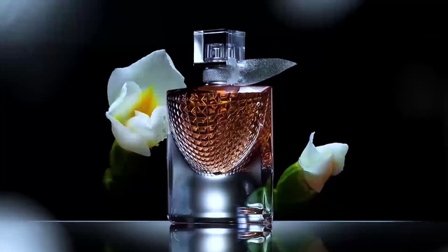 Video Reference: Perfume, Product, Glass bottle, Still life photography, Bottle, Glass, Liquid, Flower, Plant, Barware