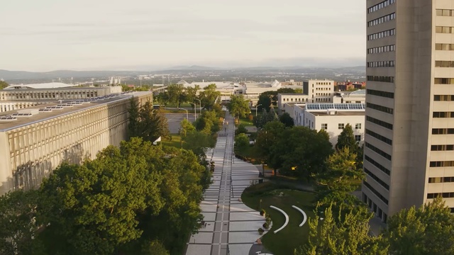 Video Reference: Metropolitan area, Urban area, City, Aerial photography, Daytime, Residential area, Tower block, Human settlement, Atmospheric phenomenon, Building, Person