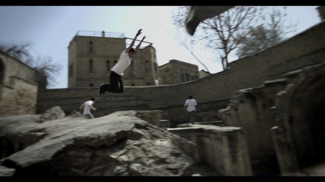 Video Reference: Wall, Street stunts, Freestyle walking, Flip (acrobatic), Tree, Photography, Extreme sport, Screenshot, Rock