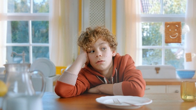 Video Reference: Child, Sitting, Room, Window, Table, Home, Furniture, Leisure, Interior design, Flooring, Person