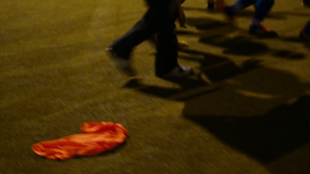 Video Reference: Red, Orange, Leg, Foot, Human body, Footwear, Fun, Floor, Performance art, Shadow, Person