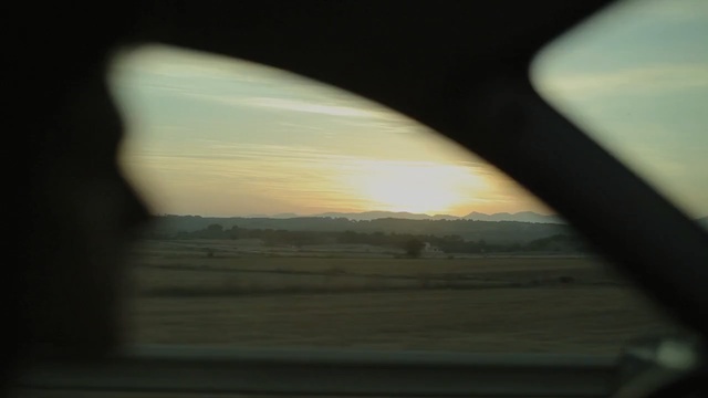 Video Reference: Sky, Tints and shades, Cloud, Window, Sunlight, Rear-view mirror, Shadow, Sunset, Automotive window part