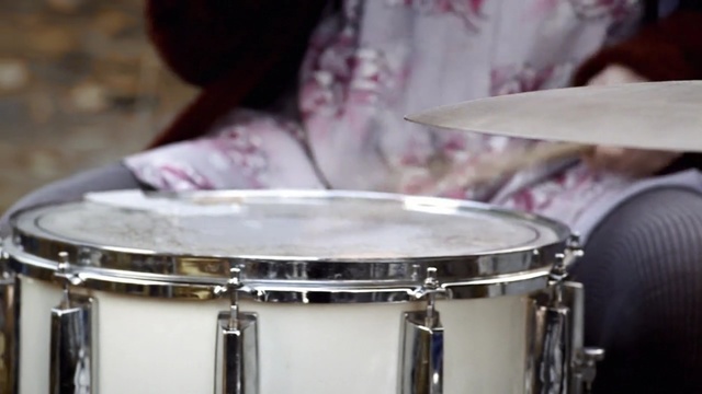 Video Reference: drum, musical instrument, snare drum, tom tom drum, percussion, drumhead, percussionist, bass drum, timbale, timbales, Person