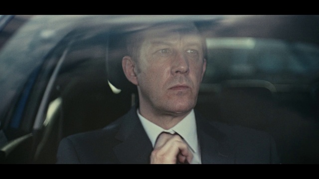 Video Reference: Face, Head, Forehead, Human, Movie, Businessperson, Photography, Family car, Photo caption, Pleased