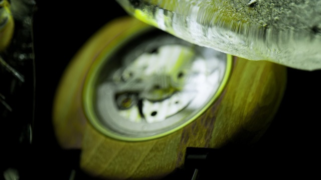 Video Reference: Green, Water, Yellow, Close-up, Macro photography, Footwear, Automotive wheel system, Photography, Auto part, Shoe, Person