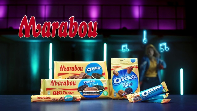 Video Reference: Product, Snack, Games, Indoor, Table, Sitting, Food, Front, Screen, Black, Monitor, Desk, Computer, Orange, Television, Pink, Standing, Remote, Man, Store, Sign, White, Text, Fast food