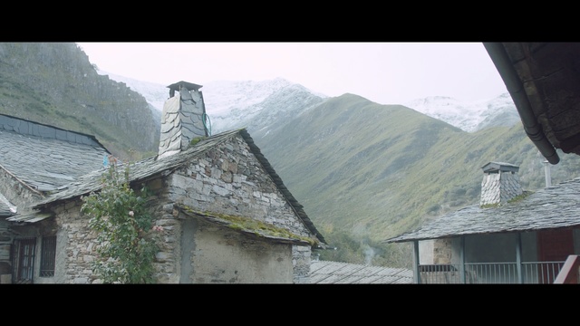 Video Reference: mountain range, sky, mountainous landforms, mountain, roof, house, village, town, architecture, rural area
