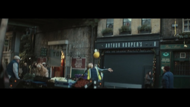 Video Reference: Pc game, Darkness, Town, Snapshot, Screenshot, Urban area, Crowd, Photography, Midnight, Metropolitan area, Man, Ball, Woman, Player, Standing, Front, Sitting, Playing, People, Holding, Large, Swinging, City, Room, Walking, Game, Street, Table, Young, Television, Court, Red, White, Sign, Air, Blue, Video game, Text, Cartoon