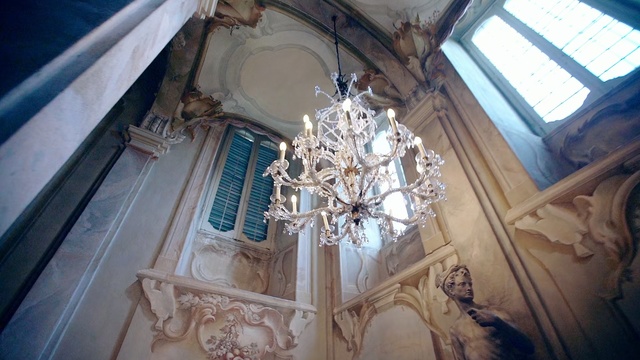 Video Reference: Chandelier, Architecture, Light fixture, Person