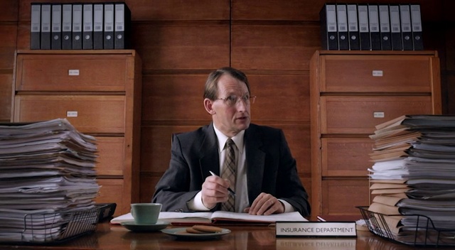 Video Reference: Official, Footwear, Desk, Furniture, Wood, Court, White-collar worker, Business, Suit, Shoe