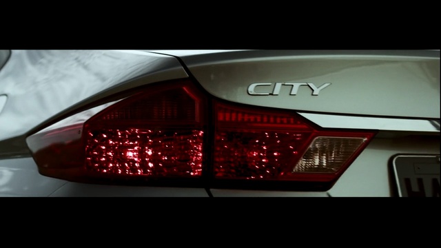 Video Reference: Land vehicle, Vehicle, Car, Automotive lighting, Automotive design, Automotive tail & brake light, Mid-size car, Light, Executive car