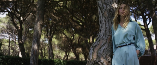 Video Reference: tree, nature, woody plant, plant, girl, forest, grass, woodland, sunlight, branch, Person