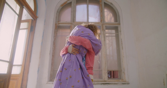 Video Reference: Window, Sleeve, Purple, Pink, Street fashion, Wrap, Tints and shades, Magenta, Facade, Shawl