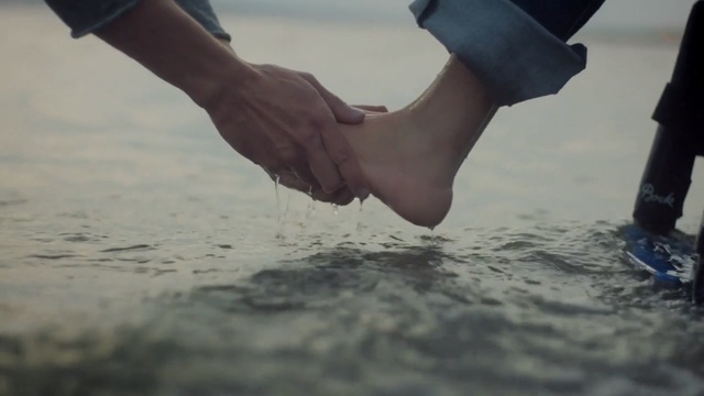 Video Reference: Water, Hand, Footwear, Leg, Gesture, Human leg, Ankle, Foot, Vacation, Shoe