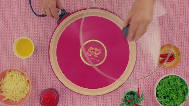 Video Reference: Pink, Circle, Placemat, Textile, Magenta, Plate, Tablecloth, Tableware, Person
