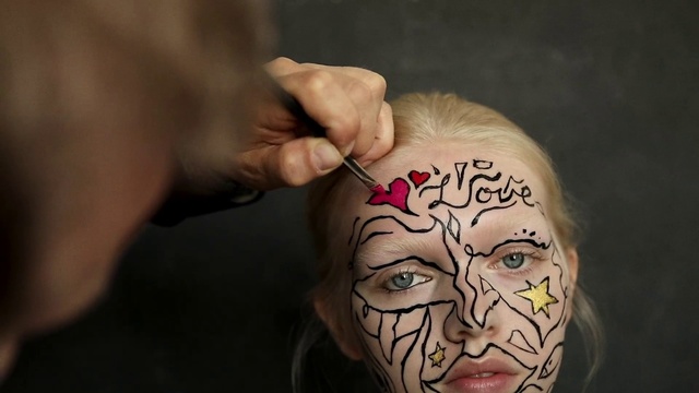 Video Reference: Face, Forehead, Skin, Head, Cheek, Tattoo, Human, Arm, Joint, Makeup artist