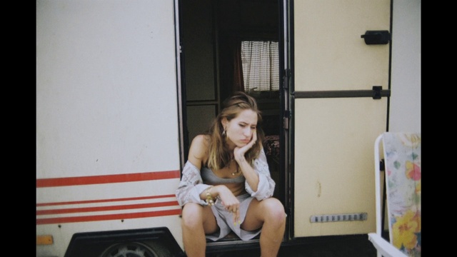 Video Reference: Leg, Skin, Sitting, Yellow, Blond, Room, Long hair, Human leg, Vacation, Child