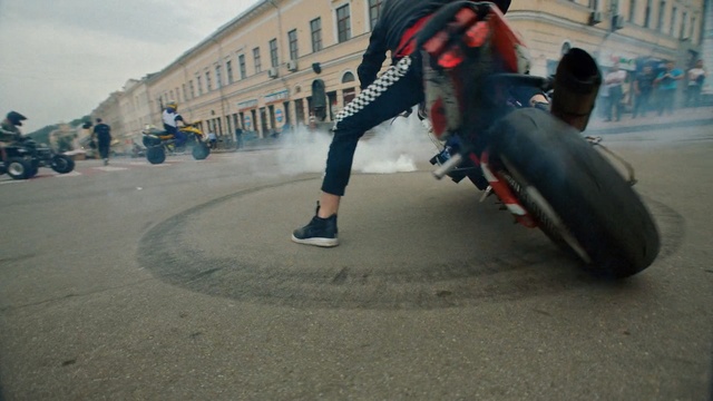 Video Reference: vehicle, car, mode of transport, stunt performer, asphalt, stunt, motorcycle, extreme sport, road, recreation