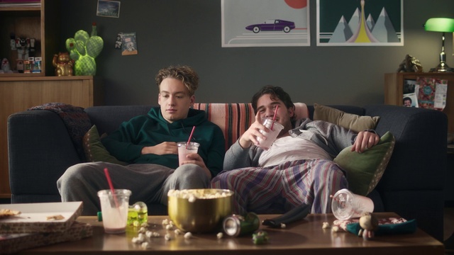 Video Reference: Sitting, Couch, Conversation, Drink, Room, Alcohol, Table, Furniture, Brunch, Meal