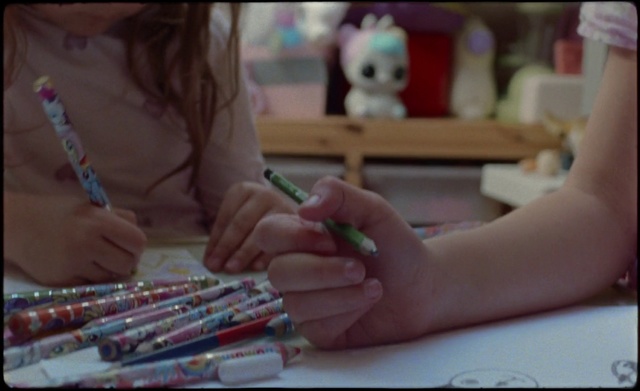Video Reference: Nail, Hand, Finger, Learning, Writing implement, Child, Play, Person, Indoor, Sitting, Table, Using, Woman, Laptop, Girl, Food, Front, Young, Computer, Plate, Holding, Cutting, Little, Man, White, People, Phone, Toddler, Baby, Toy, Child art, Text