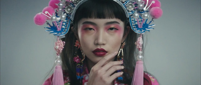 Video Reference: Face, Hair, Headpiece, Eyebrow, Head, Peking opera, Lady, Forehead, Lip, Hair accessory, Person