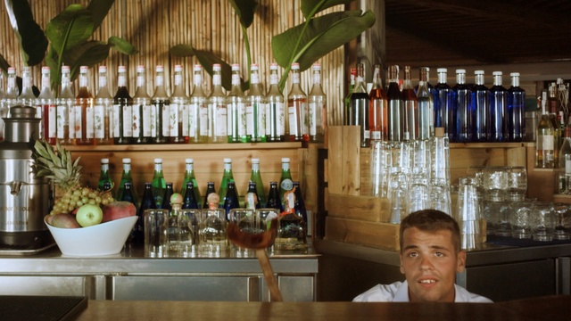 Video Reference: drink, bar, distilled beverage, interior design, liquor store, restaurant, Person