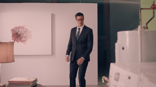 Video Reference: suit, formal wear, gentleman, outerwear, tuxedo, furniture, white collar worker, Person