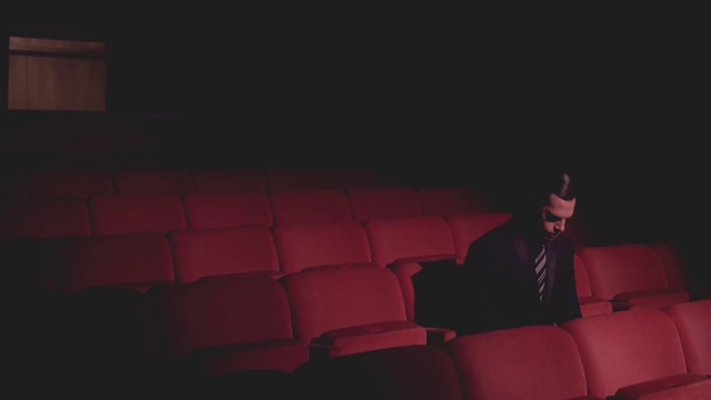 Video Reference: Red, Black, Couch, Darkness, Room, Movie theater, Photography, Furniture
