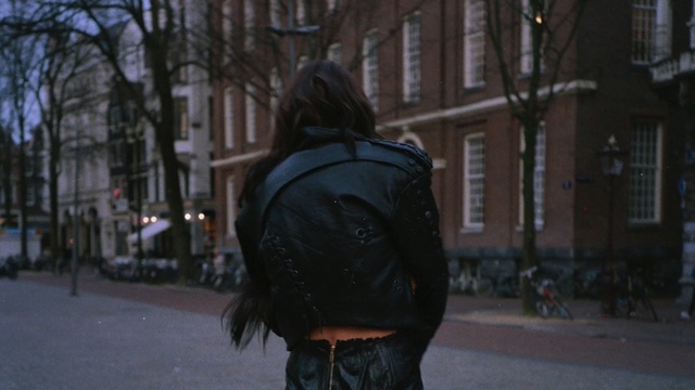 Video Reference: backpack, bag, container, city, street, Person