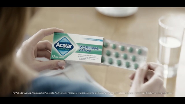 Video Reference: Hand, Medicine, Analgesic, Pharmaceutical drug, Pill, Chewing gum, Prescription drug, Brand, Indoor, Person, Sitting, Remote, Woman, Toothbrush, Food, Using, Small, Brush, Video, Control, Game, Table, Playing, Bed, Close, White, Teeth, Holding, Young, Laying, Wii, Brushing, Blurry, Man, Cat, Text, Screenshot