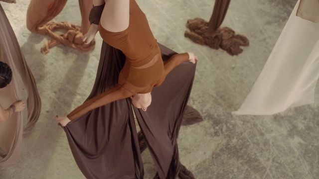 Video Reference: Brown, Leg, Fashion, Arm, Long hair, Dress, Footwear, Hand, Photography, Sitting, Person