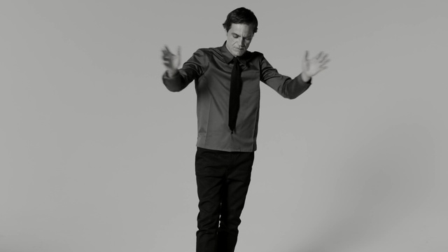 Video Reference: black, photograph, standing, black and white, sleeve, shoulder, joint, photography, outerwear, monochrome photography, Person