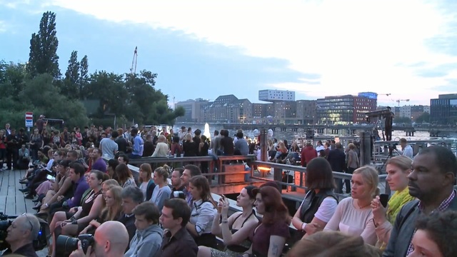 Video Reference: crowd, people, audience, city, festival, tree, recreation, tourism, event, public event, Person