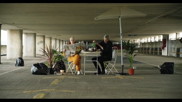 Video Reference: car, vehicle, structure, asphalt, recreation, Person