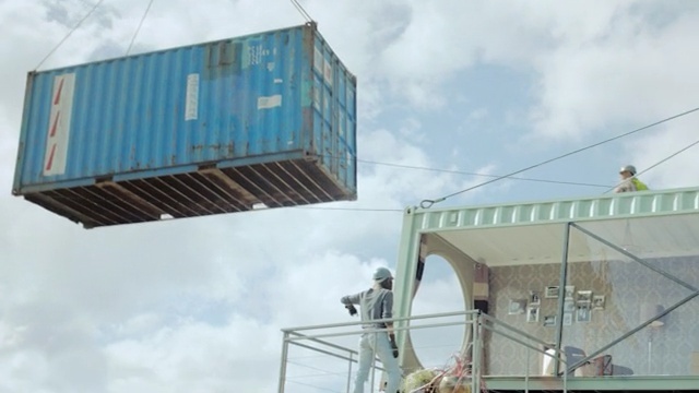 Video Reference: architecture, sky, structure, roof, facade, building, daylighting, house, glass, window, Person