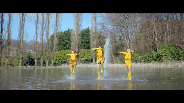 Video Reference: Water, Nature, Yellow, Reflection, Tree, Fun, Adaptation, Pond, Bank, Plant, Person, Outdoor, Orange, Small, Standing, Lake, Man, Food, Boat, Holding, Riding, Young, Group, Colored