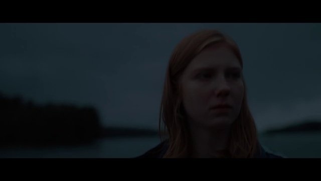Video Reference: Face, Hair, White, Black, Portrait, Head, Beauty, Lip, Nose, Lady, Person, Indoor, Woman, Looking, Front, Holding, Laptop, Sitting, Dark, Computer, Table, Hand, Young, Girl, Using, Shirt, Room, Lit, Screen, Red, Man, Standing, Screenshot, Human face