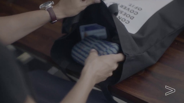 Video Reference: Arm, Hand, Leg, Finger, Nail, Photography, Sitting, Black hair, Wrist, Gesture, Indoor, Person, Table, Holding, Small, Computer, Remote, Desk, Front, Man, Using, Video, Keyboard, Young, White, Playing, Game, Room, Feet, Text, Handwriting