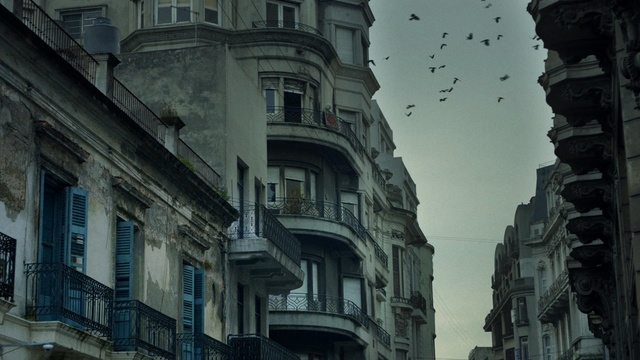 Video Reference: metropolis, building, landmark, town, architecture, urban area, city, sky, street, neighbourhood, Person