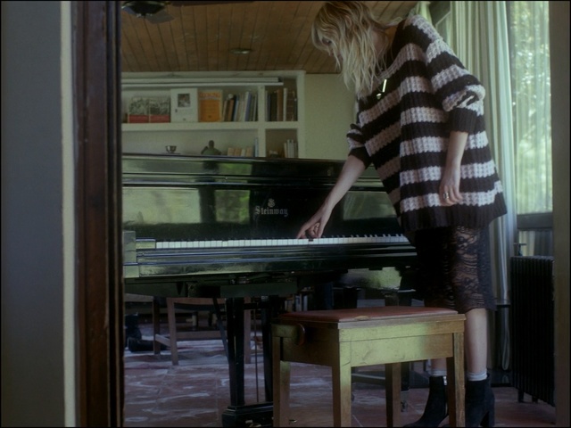 Video Reference: piano, technology, keyboard, electronic device, furniture, window, glass, musical instrument, player piano, musical keyboard, Person