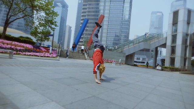 Video Reference: urban area, public space, city, sky, leisure, recreation, walkway, road, vehicle, pedestrian