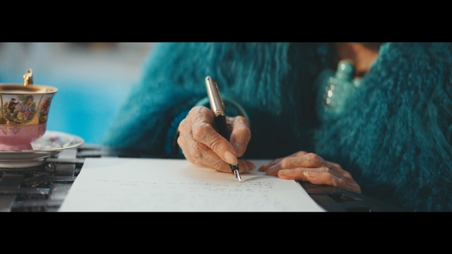 Video Reference: Hand, Turquoise, Writing instrument accessory, Finger, Human, Design, Adaptation, Writing, Art