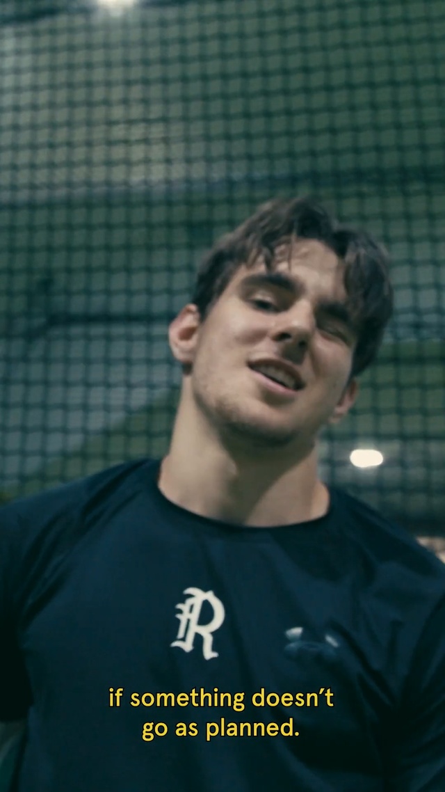 Video Reference: Facial expression, Forehead, Chin, Cool, Player, Photo caption, Smile, T-shirt, Person, Racket, Holding, Game, Man, Court, Ball, Hand, Young, Woman, Shirt, Black, Standing, Front, Baseball, Ready, Playing, Swinging, White, Tennis, Human face, Athletic game, Text, Clothing, Portrait, Male