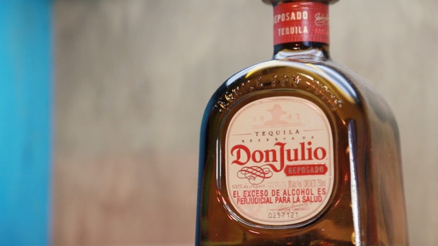 Video Reference: liqueur, distilled beverage, alcoholic beverage, drink, product, glass bottle, whisky, bottle, product